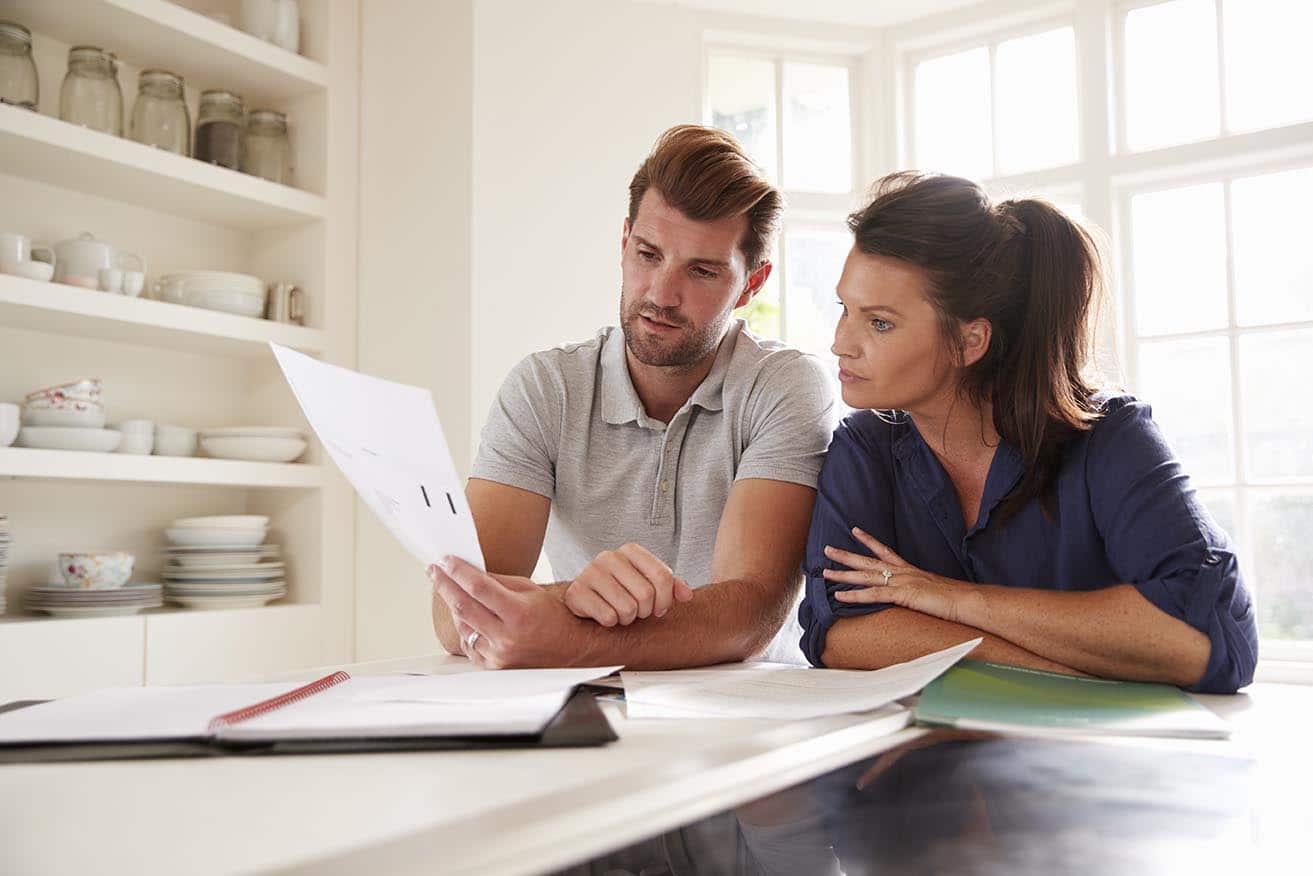 Couple looking at how to pay less tax